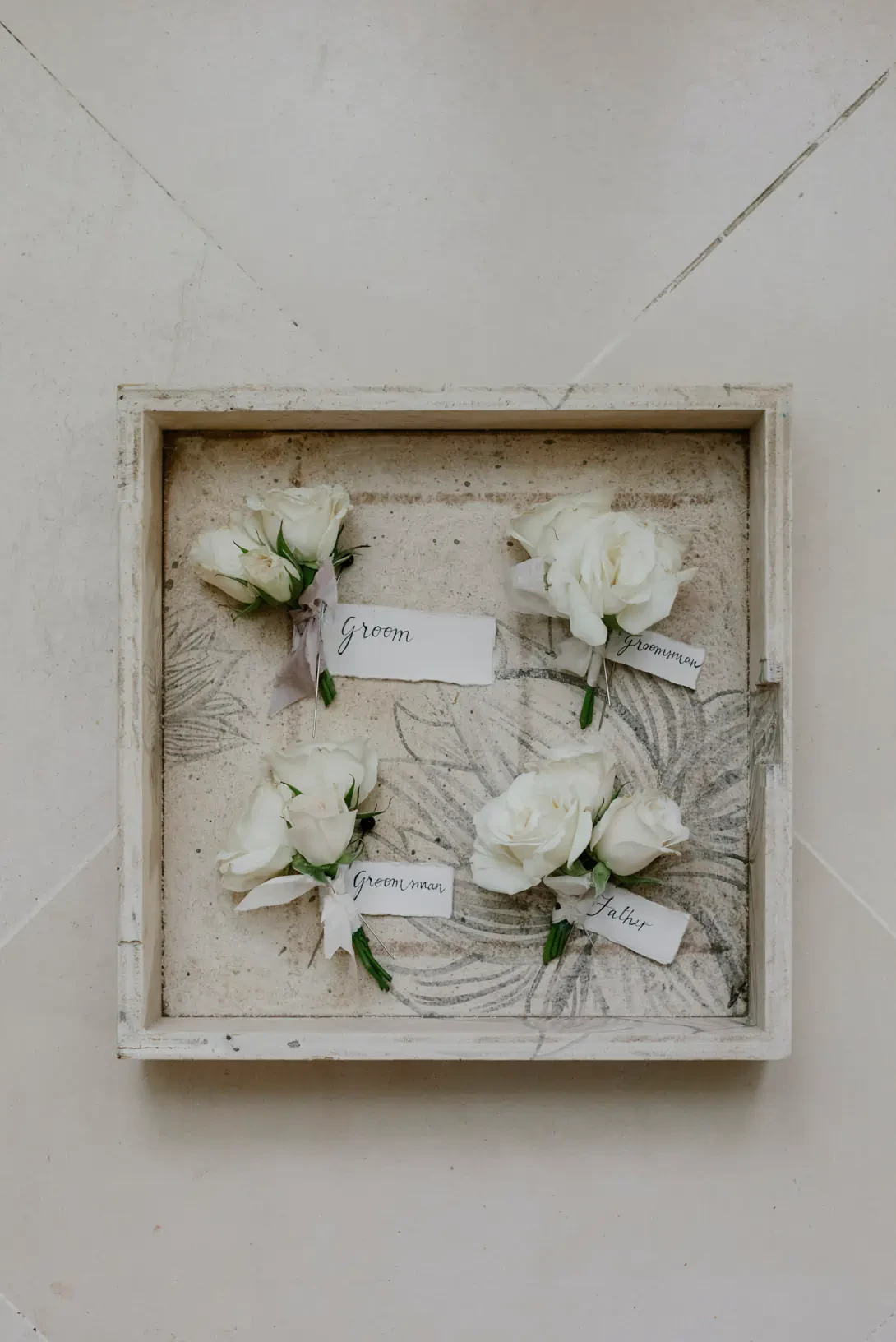 Boutonnieres with white roses