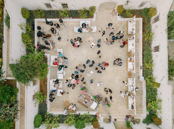 Aerial Drone View Wedding Cocktail Hour Masseria Courtyard