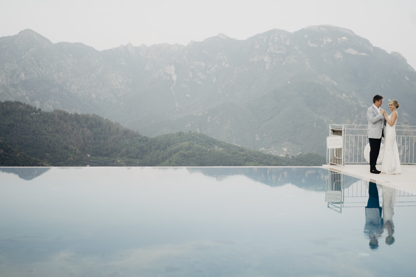 Bride and groom at the infinity pool