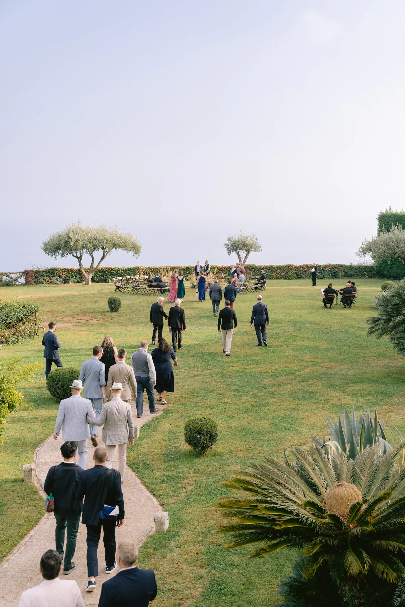 Wedding Guests Walking to Ceremony Garden Villa Cimbrone