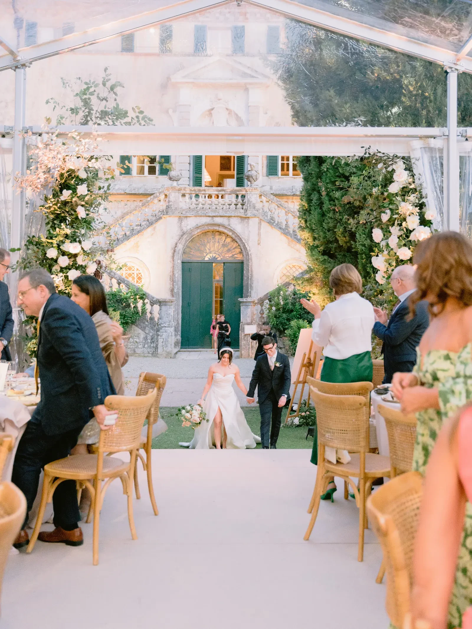 newlyweds joining the guests at the hall in Villa Cetinale Gardens