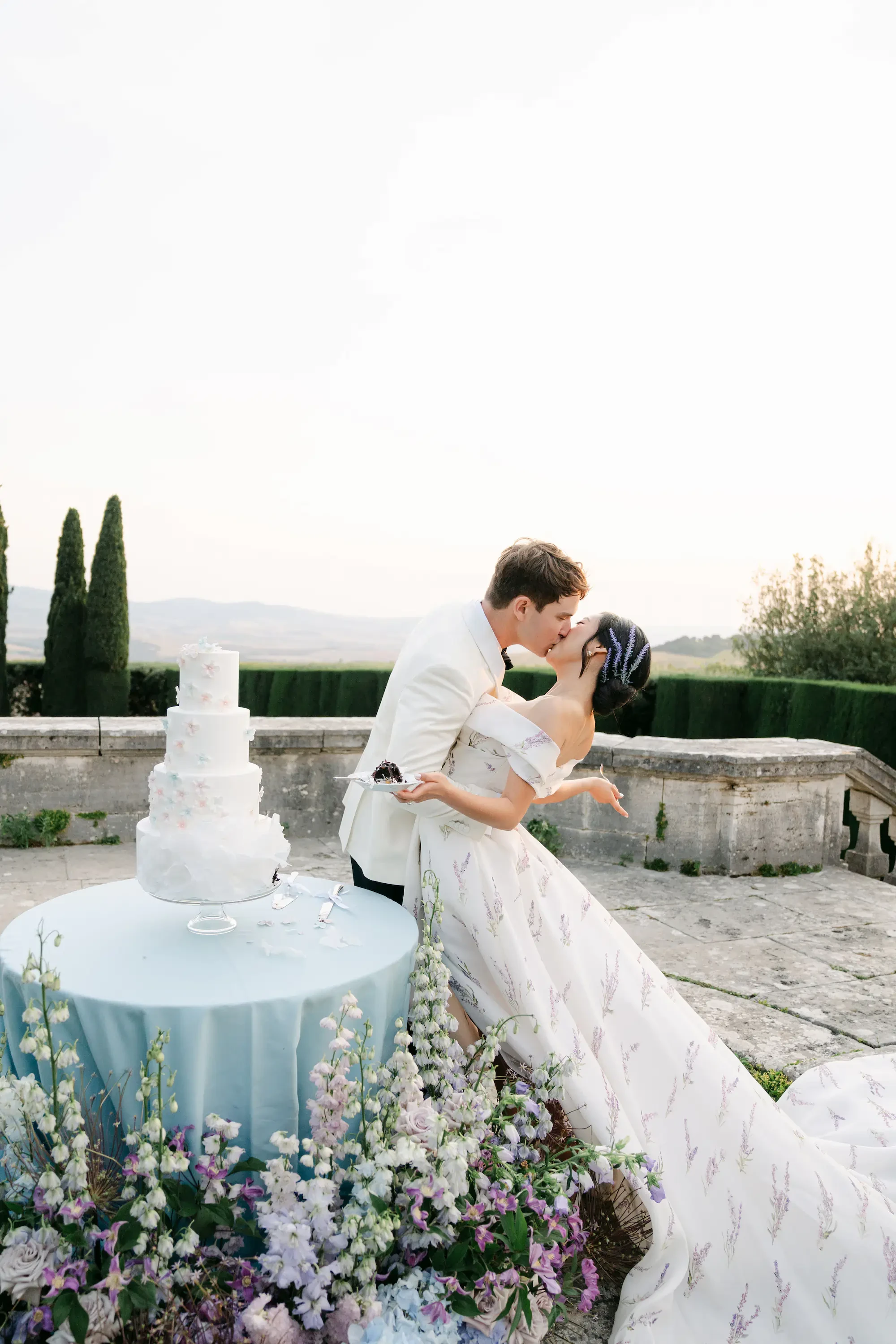 Bride And Groom Kissing After Wedding Cake Cutting