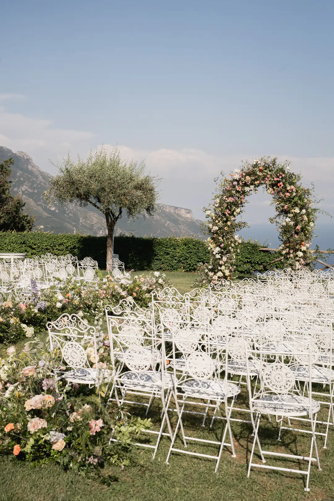 Wedding ceremony arch and seats in the gardens of Villa Cimbrone in Ravello