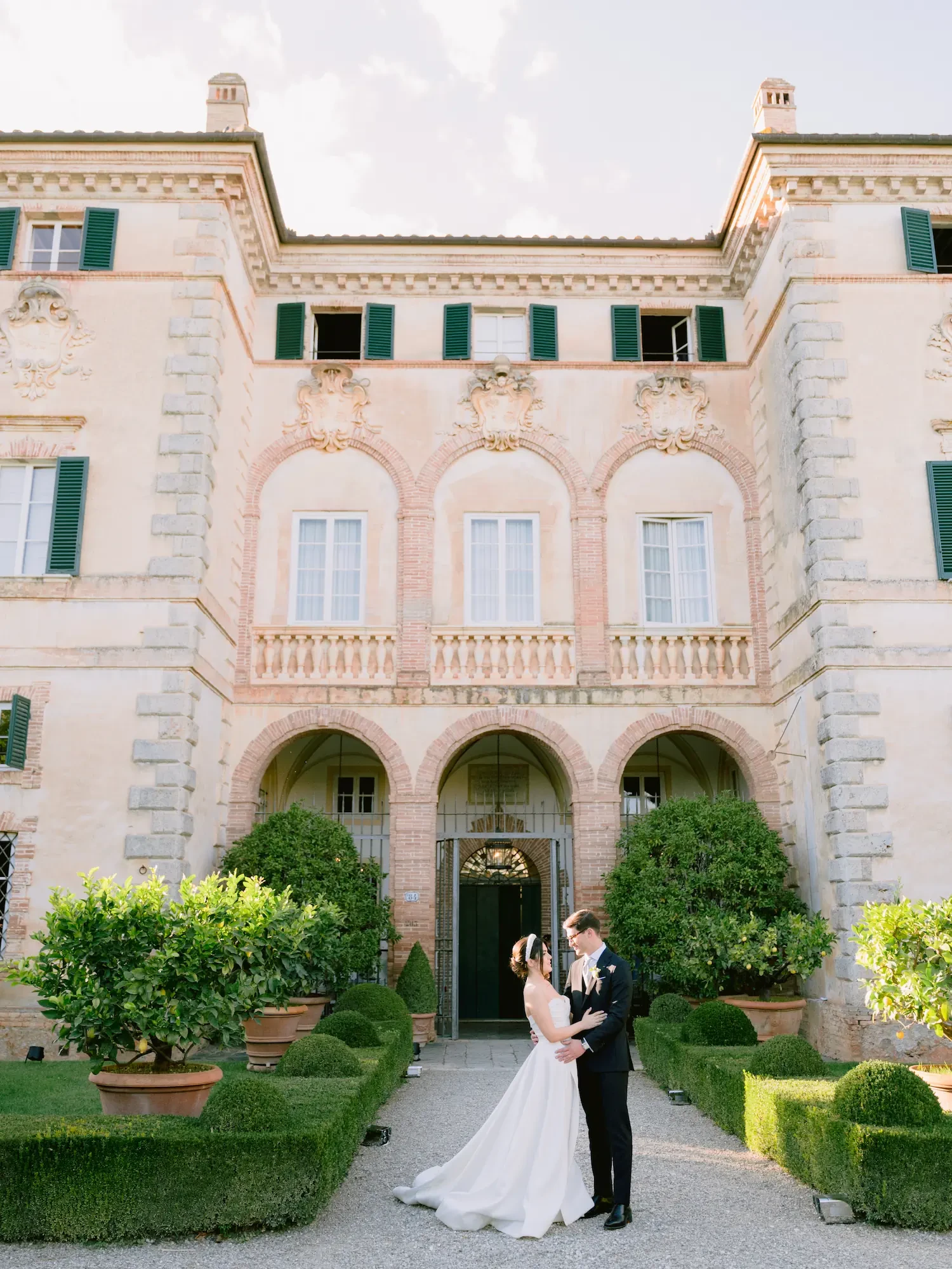 newlyweds portrait outside Villa Cetinale in Siena