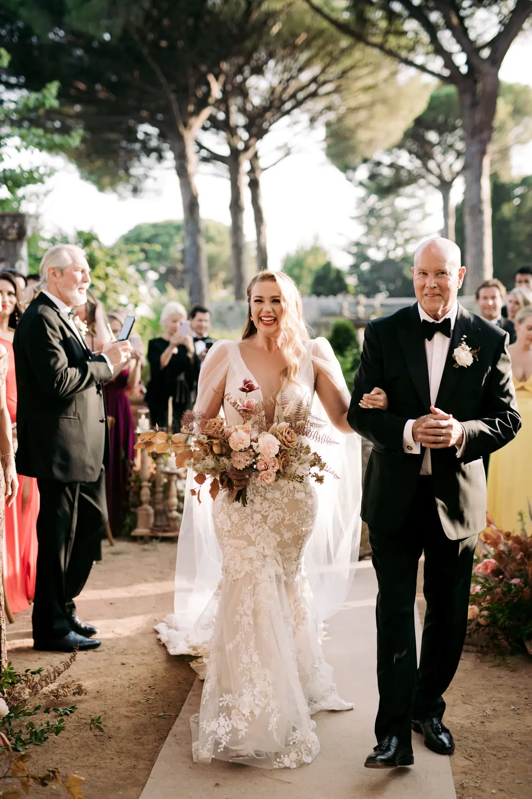 Father of the bride walking down the aisle with bride