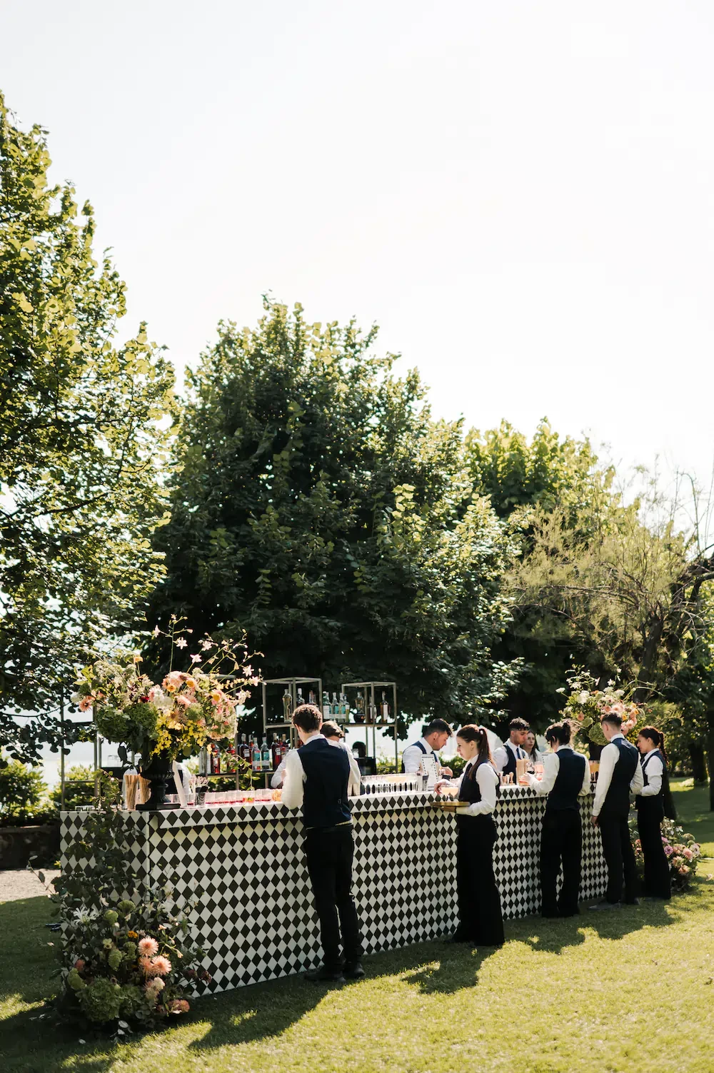 Outdoor Wedding Cocktail Bar Staff Preparing Drinks