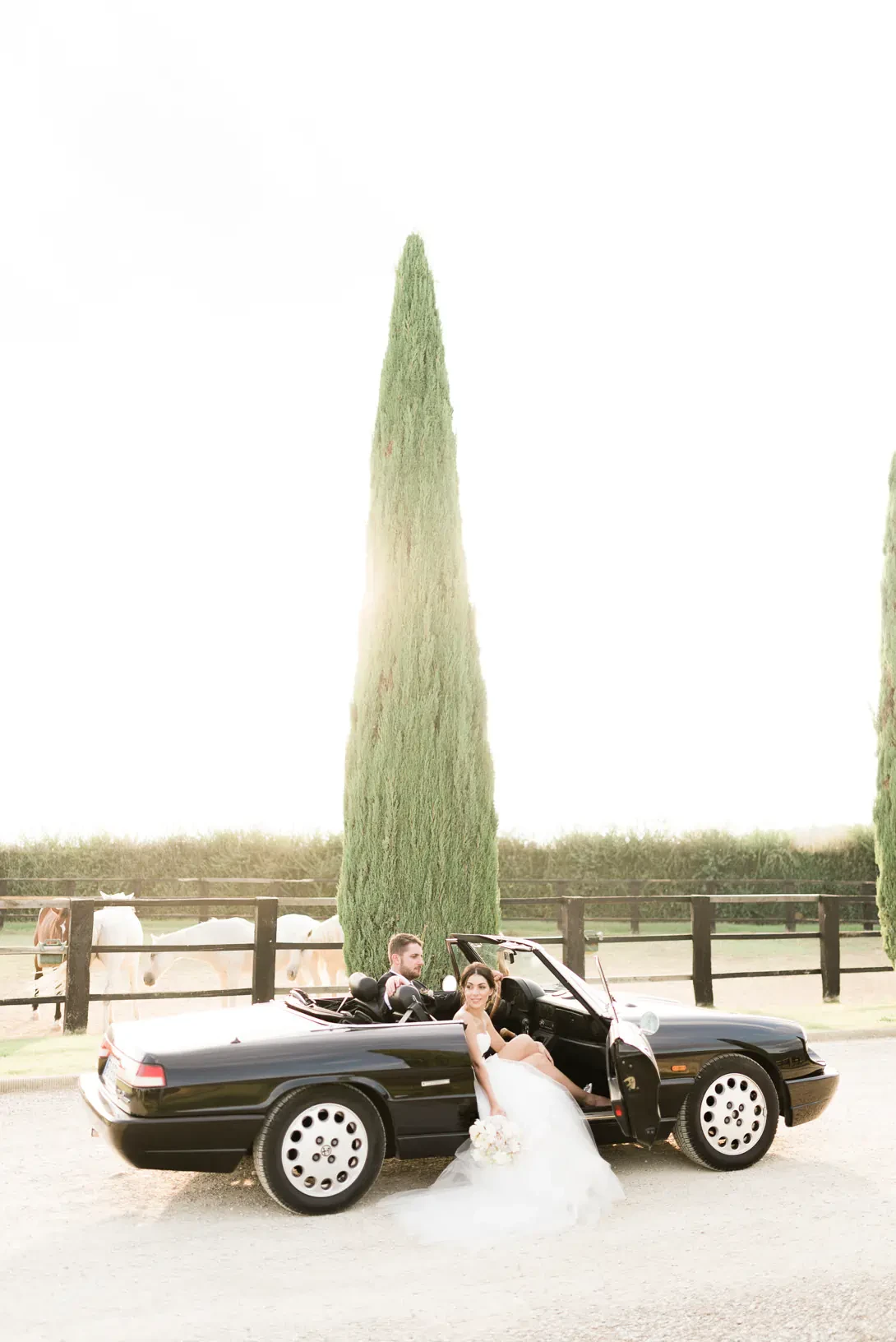 Bride and groom in a luxury car