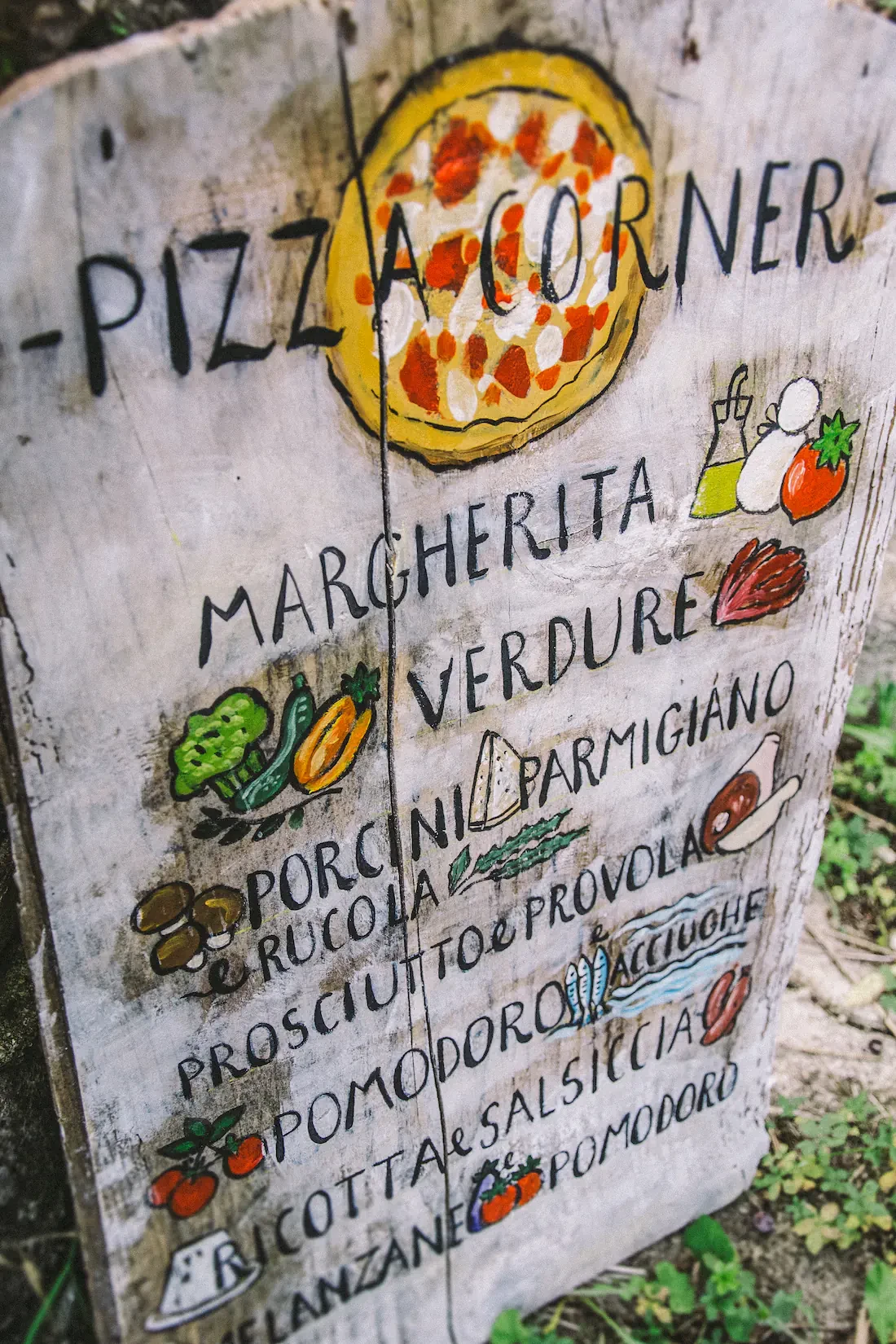 Hand painted sign for pizza corner