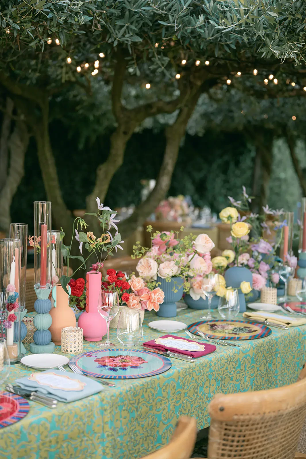 Table setting under the olive threes at Hotel Caruso