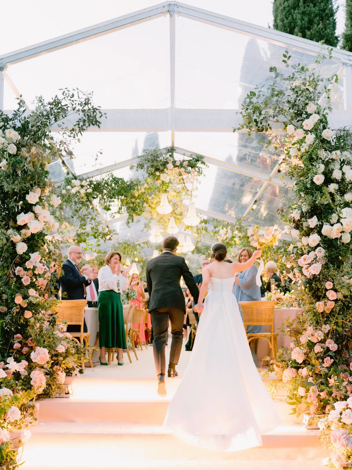 newlyweds joining the guests at the wedding dinner in Villa Cetinale Gardens