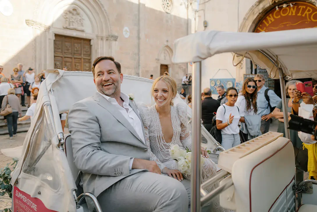 Bridal couple on a vintage car