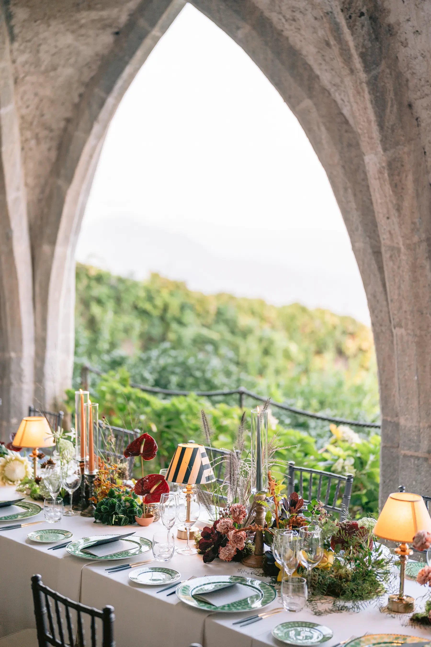 Wedding Reception Table Setting Under Historic Crypt Arches