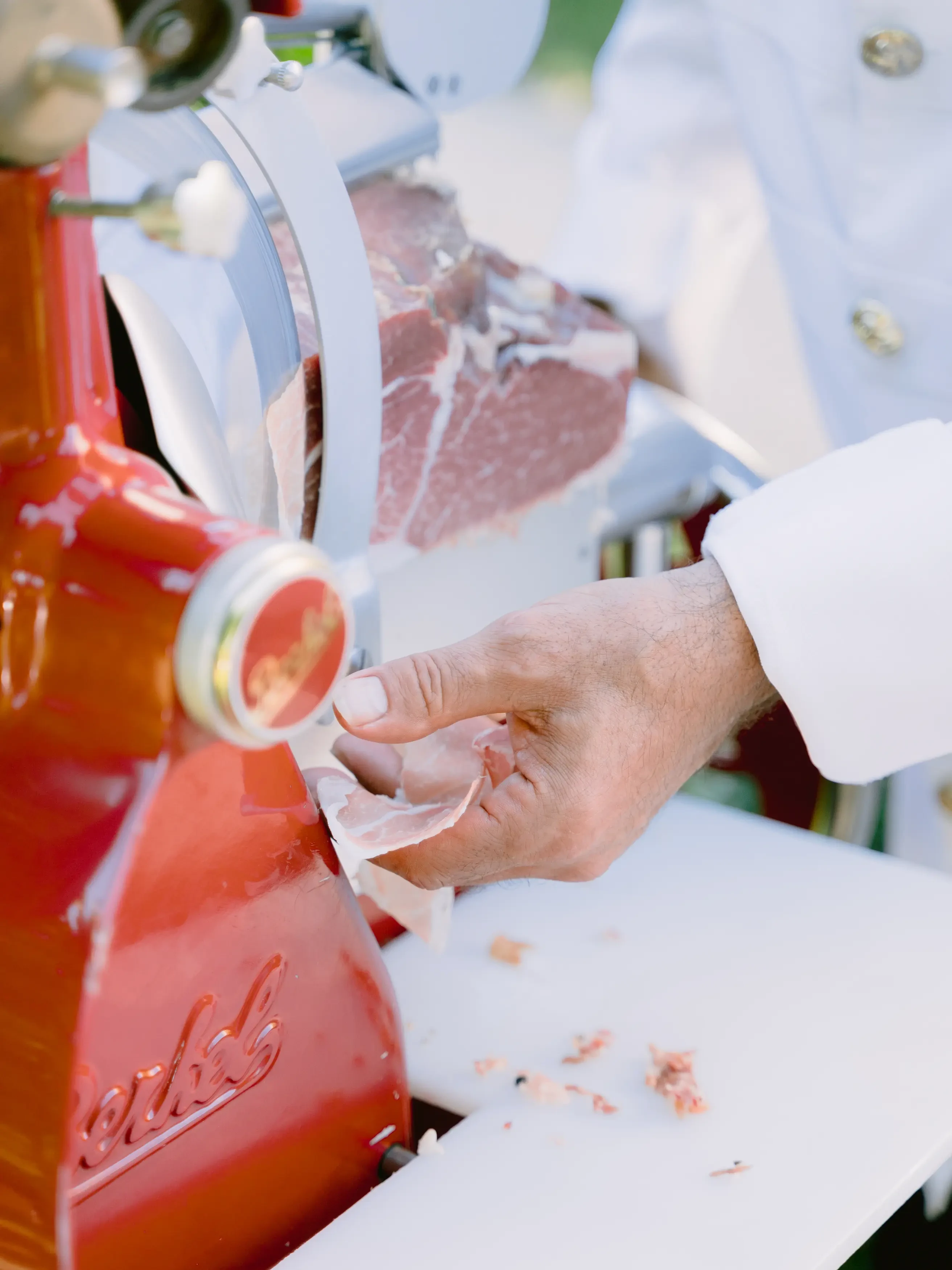 Freshly cut prosciutto at a wedding aperitif in Villa Cetinale