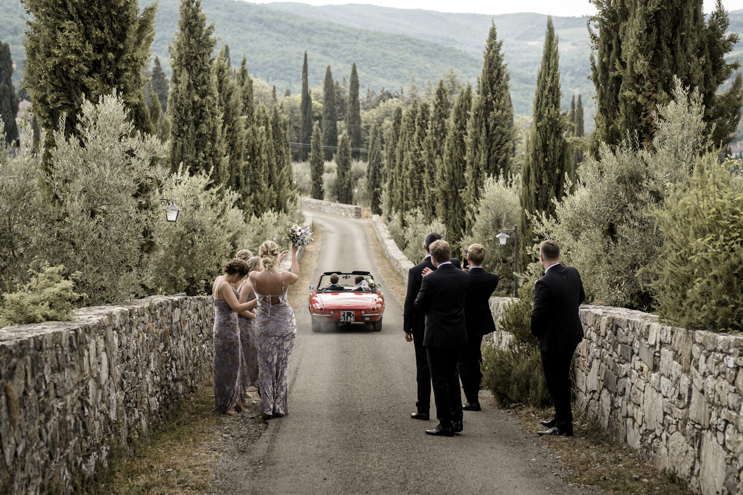 Newlyweds on a luxury car